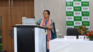 Dr. Vineeta Goel addressing Delhi University students and faculty during a breast and cervical cancer awareness workshop, featuring a TFD (Touch, Feel & Detect) session on breast self-examination.