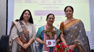 Dr. Vineeta Goel addressing Delhi University students and faculty during a breast and cervical cancer awareness workshop, featuring a TFD (Touch, Feel & Detect) session on breast self-examination.